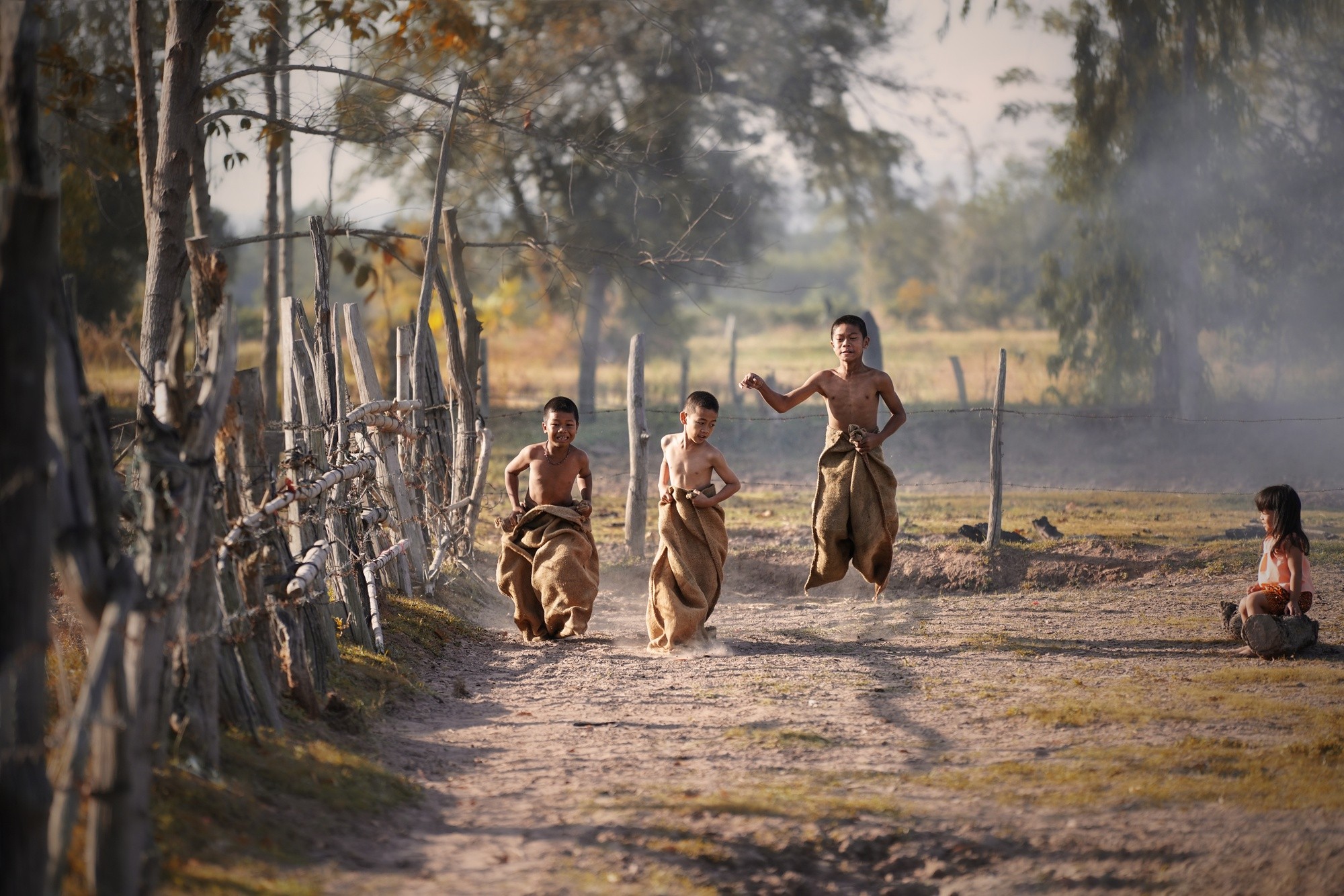 Children racing along a village track
